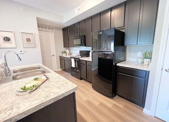 Kitchen with a Marble Countertop at Hebron Station Apartments, Hebron