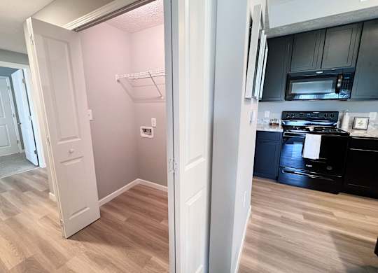 Kitchen Area and a Laundry Closet at Hebron Station Apartments, Hebron, Kentucky