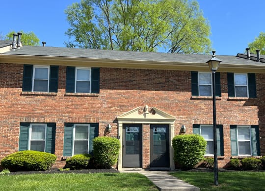 the front of a brick house with a front doorat Revere Village Apartments, Centerville, Ohio