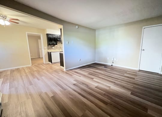 an empty living room with wood flooring at Hunter Ridge Apartments, Cincinnati