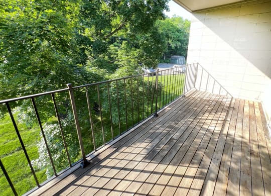 the balcony has a view of the trees and the river at Crown Pointe Apartments, Kentucky, 41014