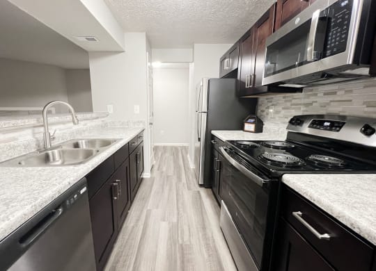 full kitchen with stainless steel appliances at the reserve at walnut creek apartments at The Vinings Apartments, Ohio, 45245