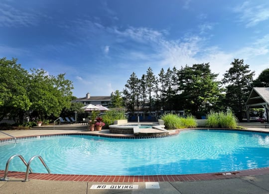 a swimming pool at the resort on a sunny day at Deercross Apartments, Cincinnati, OH