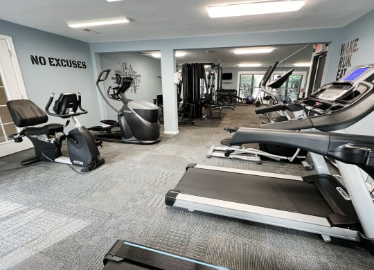 a gym with treadmills and other exercise equipment  at Deercross Apartments, Ohio