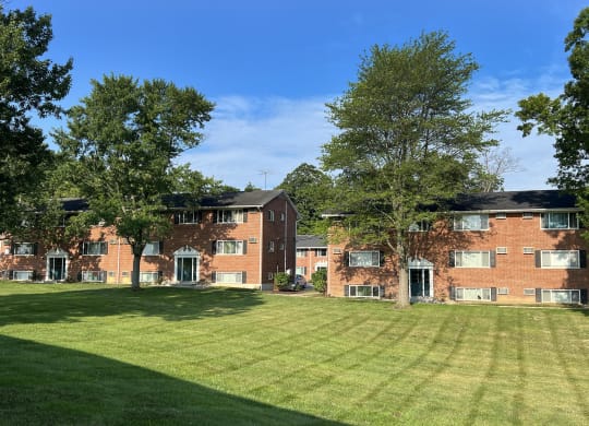 a large lawn in front of a brick apartment building at Sharondale Woods Apartments, Cincinnati, 45241