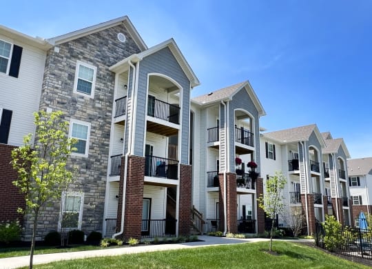 a row of apartment buildings with brick and stone exterior  at Parkway Trails, Florence, KY, 41042