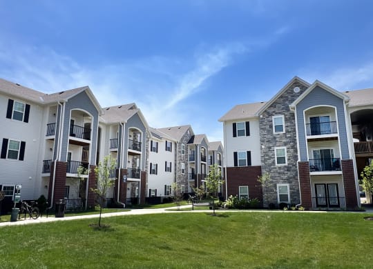 a row of apartment buildings on a sunny day at Parkway Trails, Florence