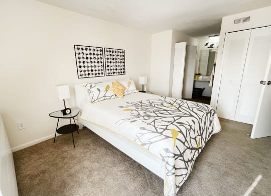 a bedroom with a large bed and carpeted floor at Miamisburg by the Mall, Miamisburg, 45342