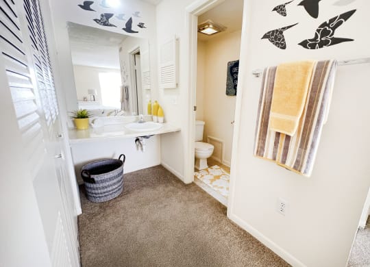 a bathroom with a sink and a mirror and a shower at Miamisburg by the Mall, Ohio