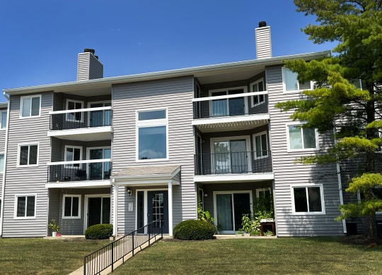 a large white house with a yard in front of it at Deercross Apartments, Cincinnati, OH