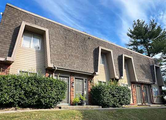 a house with three windows on the side of it