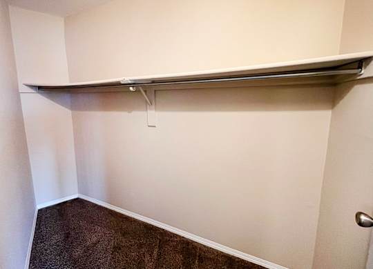 a walk in closet with a long horizontal bar on the wall at Indian Lookout Apartments, Cincinnati, OH, 45238