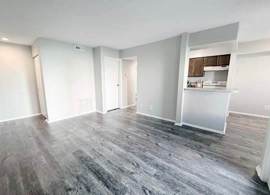 A room with a grey floor and white walls.