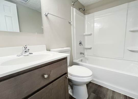 the preserve at ballantyne commons apartment bathroom with tub sink and toilet at Revere Village Apartments, Centerville, Ohio