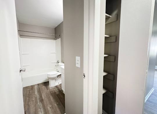 A small white bathroom with a toilet and a sink.