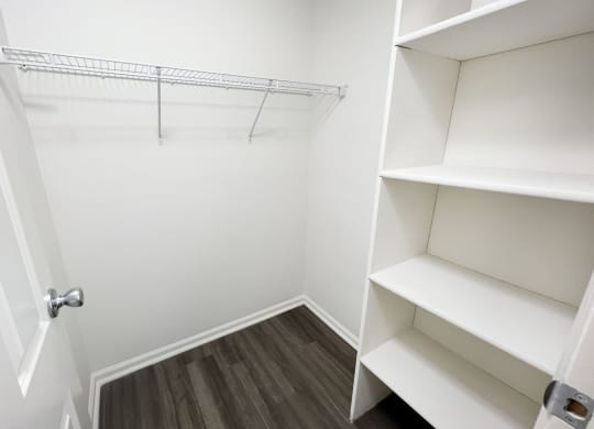 a closet in a small room with shelves and a door  at Deercross Apartments, Cincinnati, OH, 45236