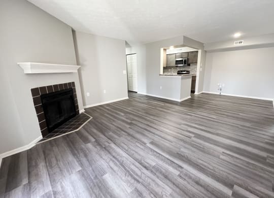 a living room with wood flooring and a fireplace  at Deercross Apartments, Ohio, 45236