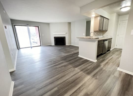 an empty living room and kitchen with wood flooring  at Deercross Apartments, Ohio, 45236