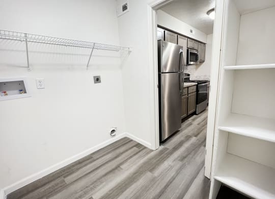 an empty kitchen with a stainless steel refrigerator and  at Deercross Apartments, Ohio