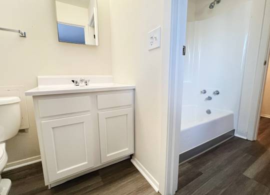 a bathroom with a sink toilet and a tub at Four Worlds Apartments, Cincinnati, Ohio