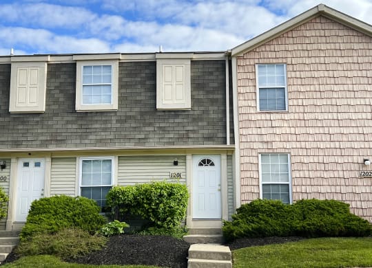 a house with a blue sky in the background  at Woodhills Apartments, West Carrollton