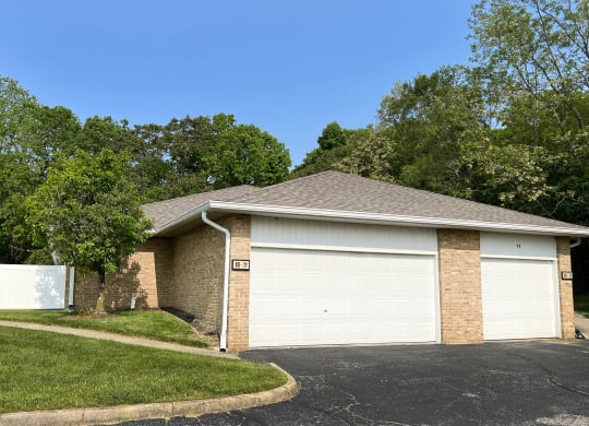 a home with a white garage door  at Wyndemere Apartments, Ohio, 45005