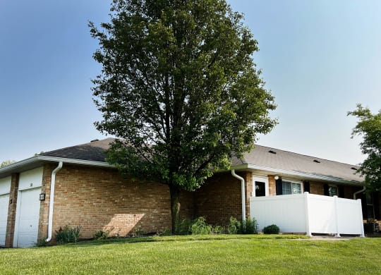 a house with a large tree in front of it  at Wyndemere Apartments, Franklin, 45005