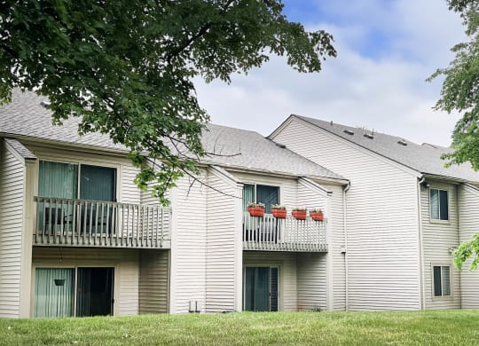 a white building with a gray roof  at Hunter's Creek Apartments, Cincinnati