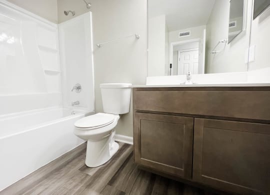 a bathroom with a toilet sink and bathtub at Crown Ridge Apartments, Ohio, 45005