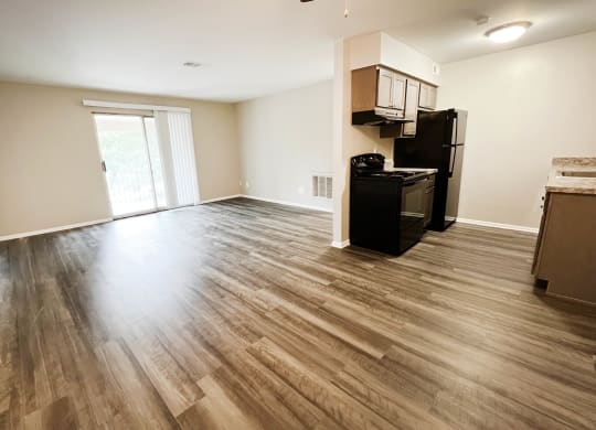 a kitchen and living room with hardwood floors at Crown Ridge Apartments, Franklin, 45005