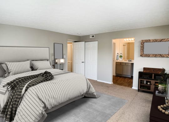 a bedroom with a bed and a bathroom with a sink at Knobs Pointe Apartments, New Albany, IN