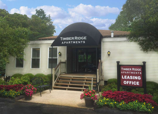 a white building with a sign that reads apartments leaseing office  at Timber Ridge Apartments, Cincinnati, Ohio