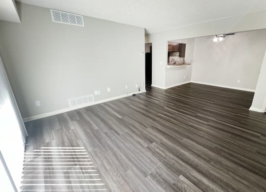 the living room of an empty apartment with wood flooring at Fox Run Apartments, Cincinnati, 45236