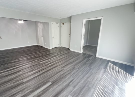 an empty living room with wood flooring and white walls at Fox Run Apartments, Cincinnati, 45236