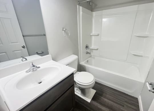 an empty bathroom with a sink toilet and bath tub at Fox Run Apartments, OH, 45236