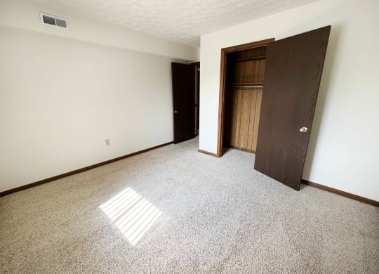 Carpeted Bedroom  at Crestbrook Apartments & Townhomes, Crescent Spring, Kentucky