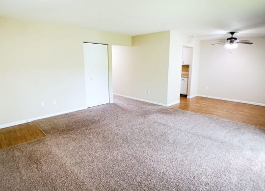 an empty living room with wood flooring and a ceiling fan  at Hunter's Creek Apartments, Cincinnati, OH, 45242