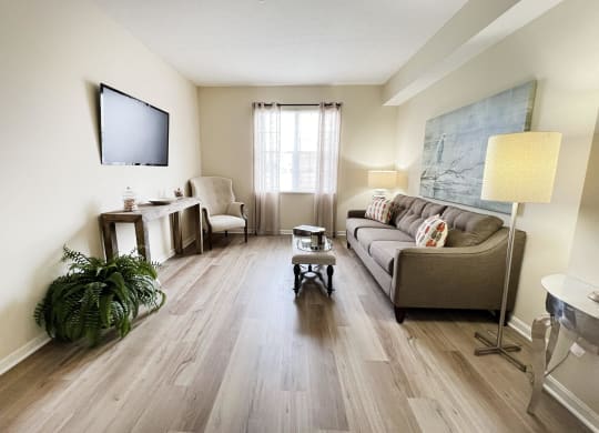 a living room with a couch and a tv at Residences at Northgate Crossing, Ohio, 43235