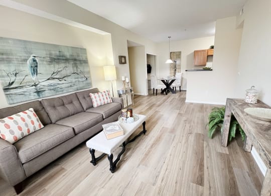 a living room with a couch and a table at Residences at Northgate Crossing, Ohio, 43235