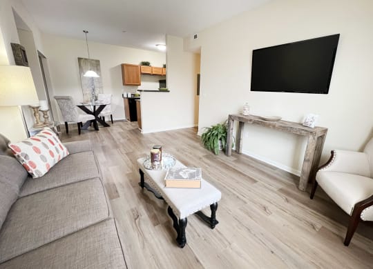 a living room with a couch and a table and a television at Residences at Northgate Crossing, Ohio, 43235