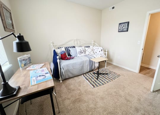 an open bedroom with a bed and a desk at Residences at Northgate Crossing, Ohio, 43235