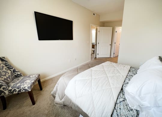 a bedroom with a bed and a television on the wallat Residences at Northgate Crossing, Ohio, 43235
