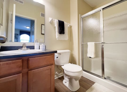 a bathroom with a shower toilet and sink at Residences at Northgate Crossing, Ohio, 43235