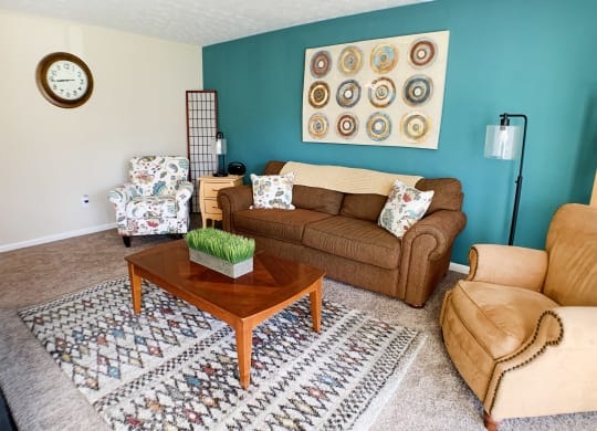 a living room with a couch and a coffee table at Timber Ridge Apartments, Cincinnati