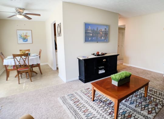 a living room with a coffee table and a dining room table at Timber Ridge Apartments, Cincinnati, OH, 45241