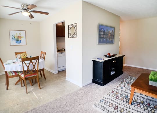 an open living room and dining room with a table and chairs at Timber Ridge Apartments, Cincinnati, Ohio