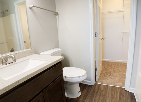 a bathroom with a toilet and a sink and a shower  at Aberdine Place, Georgetown, KY