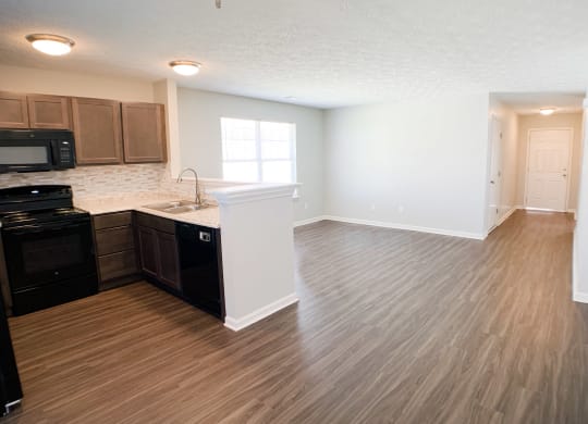 an empty kitchen and living room with wood flooring and  at Aberdine Place, Kentucky, 40324