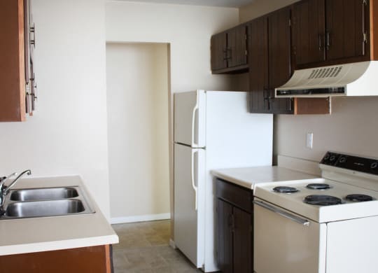 Kitchen with white appliances at Sharondale Woods Apartments, Cincinnati