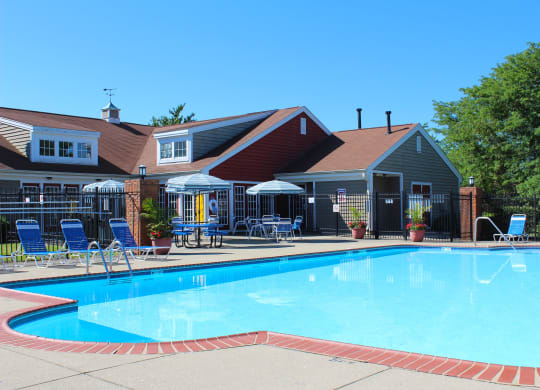 a swimming pool in front of a house with a resort style pool at Steeplechase Apartments, Loveland, 45140